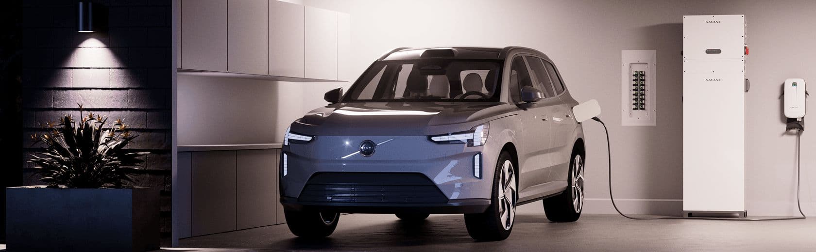 A clean garage with a Savant Power Storage 20 beside an EV