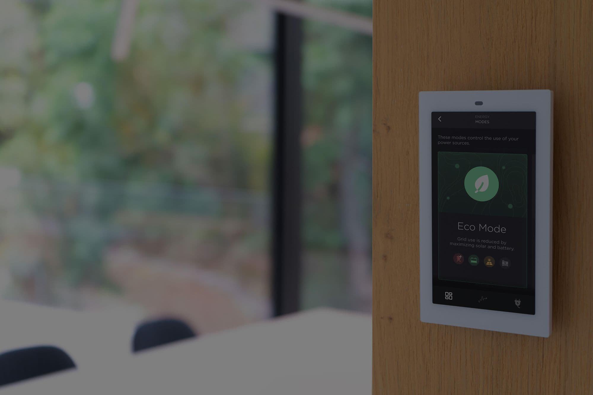 A Savant touch panel on the wall showing Eco Mode